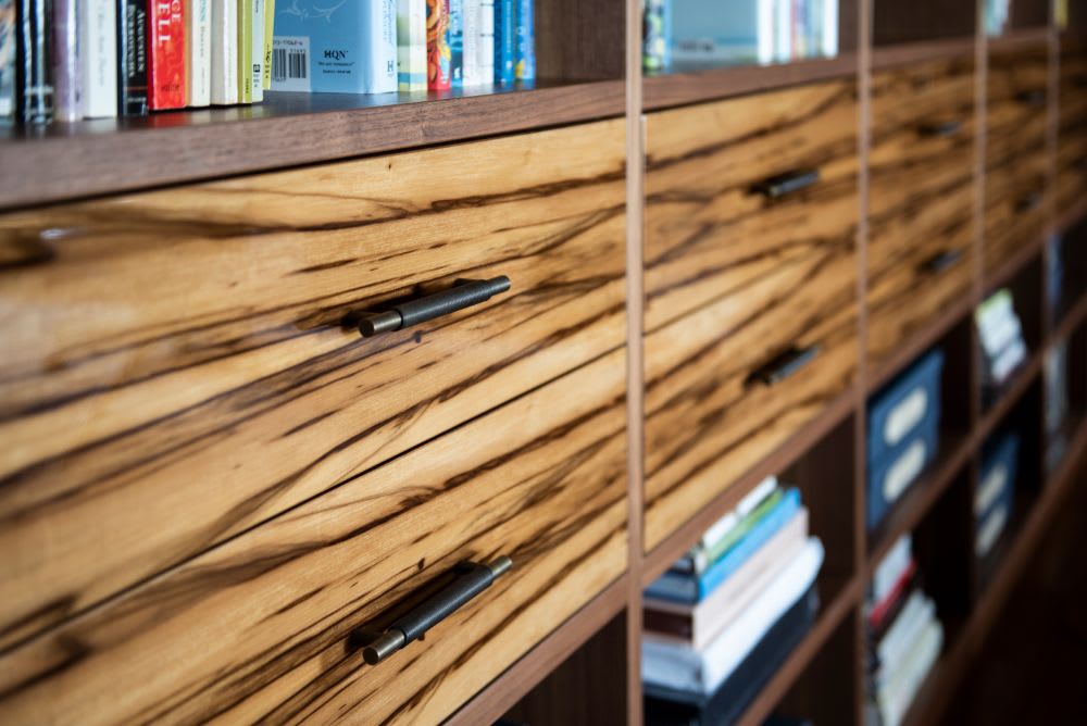 exotic wood fronts to luxury drawers in a library in a luxury belfiore condo