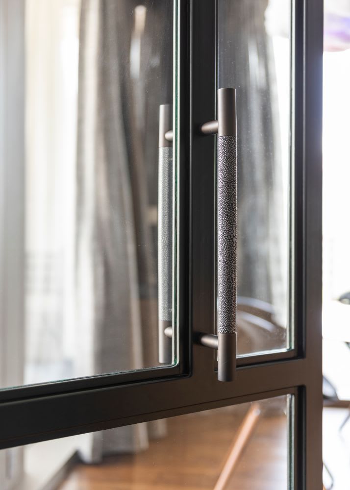 elegant modern handles used on wine bar cabinetry for a belfiore houston residence by eggersmann