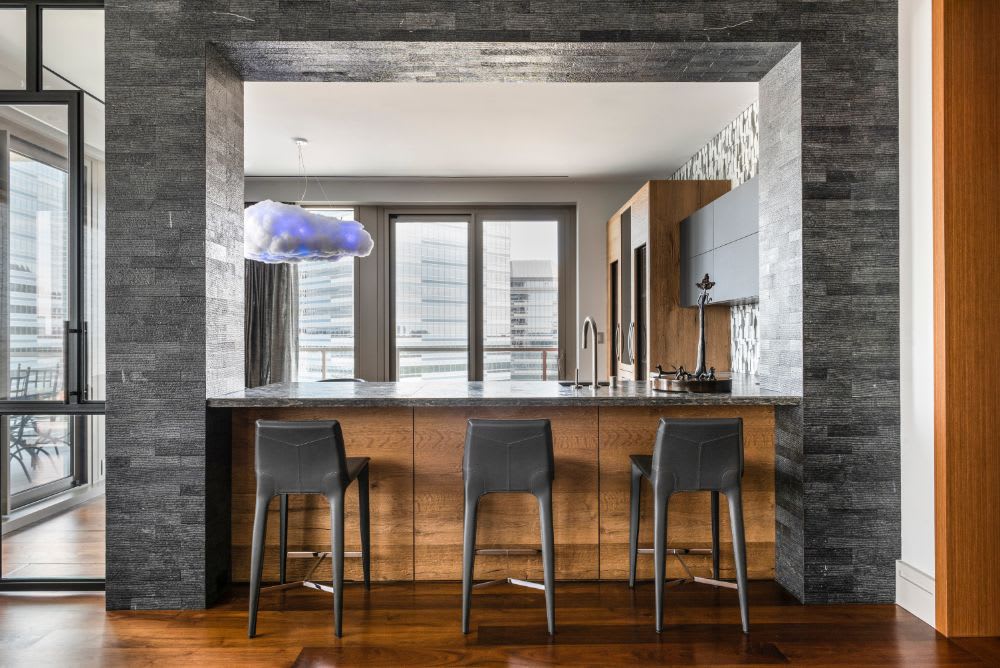 wine bottle motif in a wine bar designed for a belfiore houston residence by eggersmann