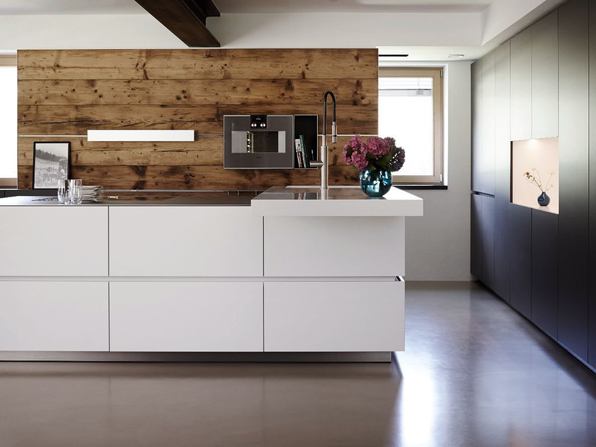 black and white kitchen with contrasting horizontal wood plank backsplash