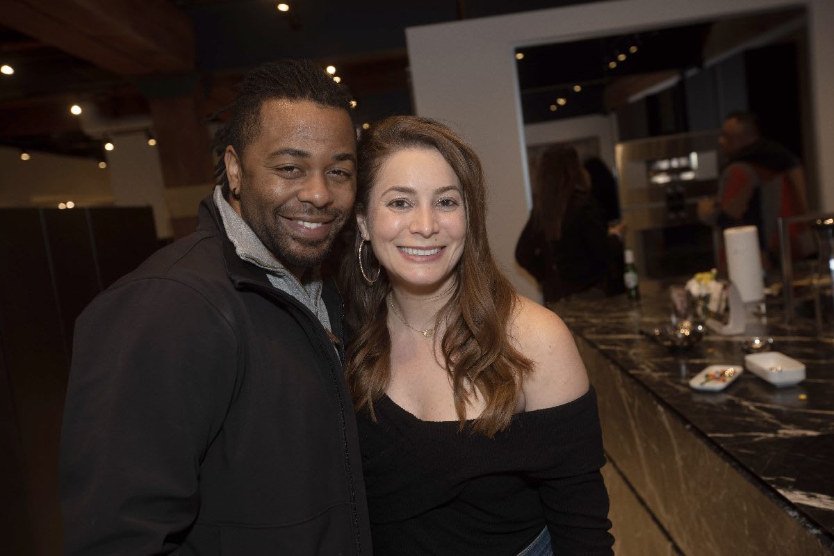 attendees at the pup crawl and cat walk charity event in the eggersmann chicago showroom