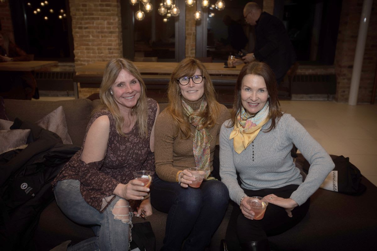 attendees at the pup crawl and cat walk fundrising event benefitting PAWS chicago in the eggersmann chicago showroom