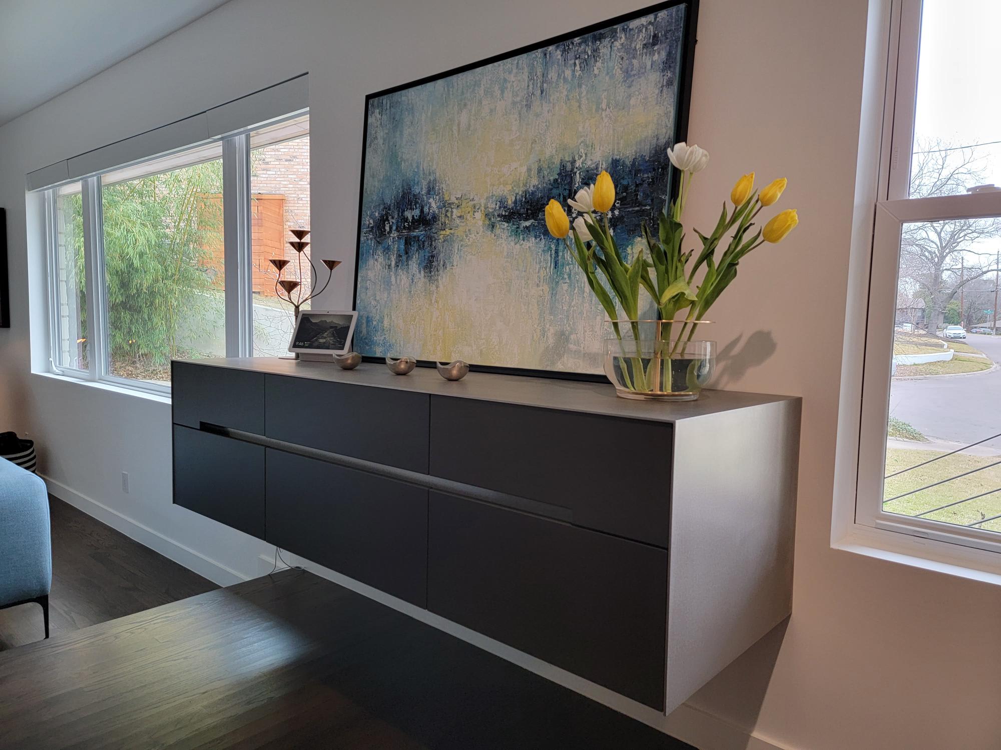 floating buffet credenza with hot-rolled steel top and side panels designed by eggersmann for a mid-centure kitchen renovation in dallas' oak cliff neighborhood