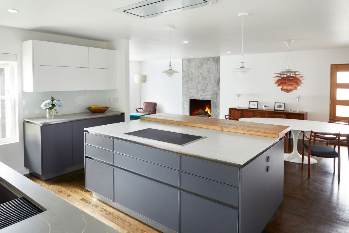 modern kitchen island with invection cooktop designed by eggersmann for a mid-century oak cliff home in dallas texas