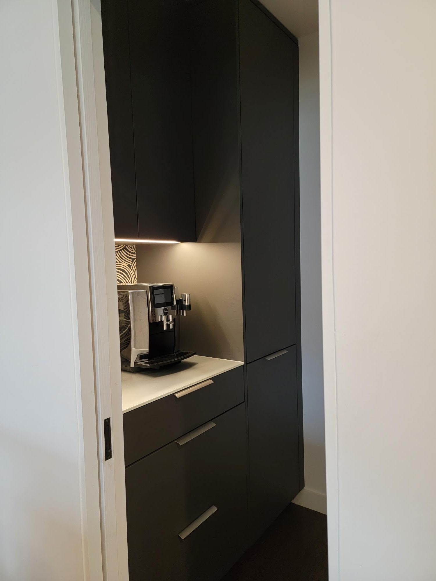 small pantry with worktop for coffee maker designed by eggersmann for a mid-centiury home's kitchen dallas' oak cliff neighborhood