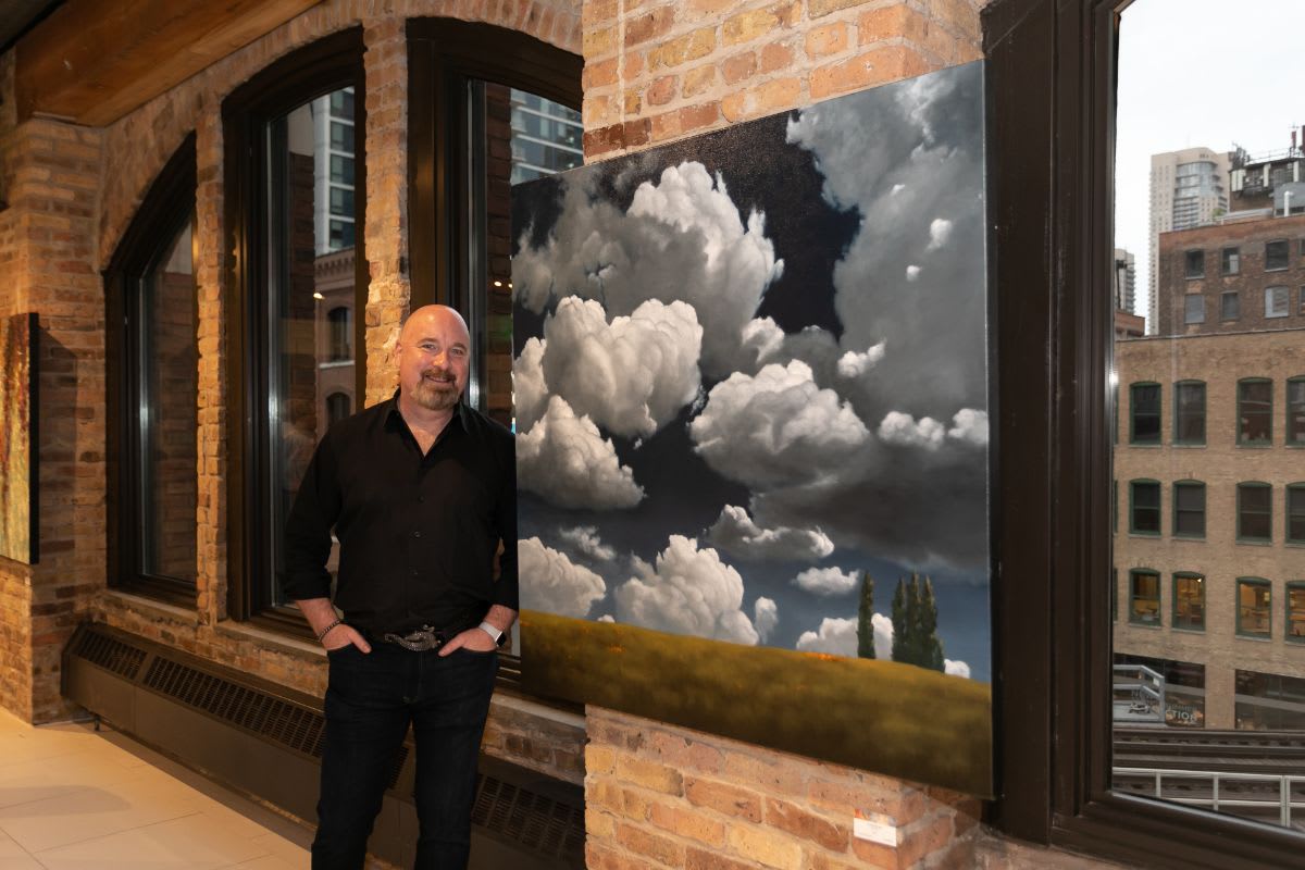 local chicago artist adam thomas with his painting titled sunshine day