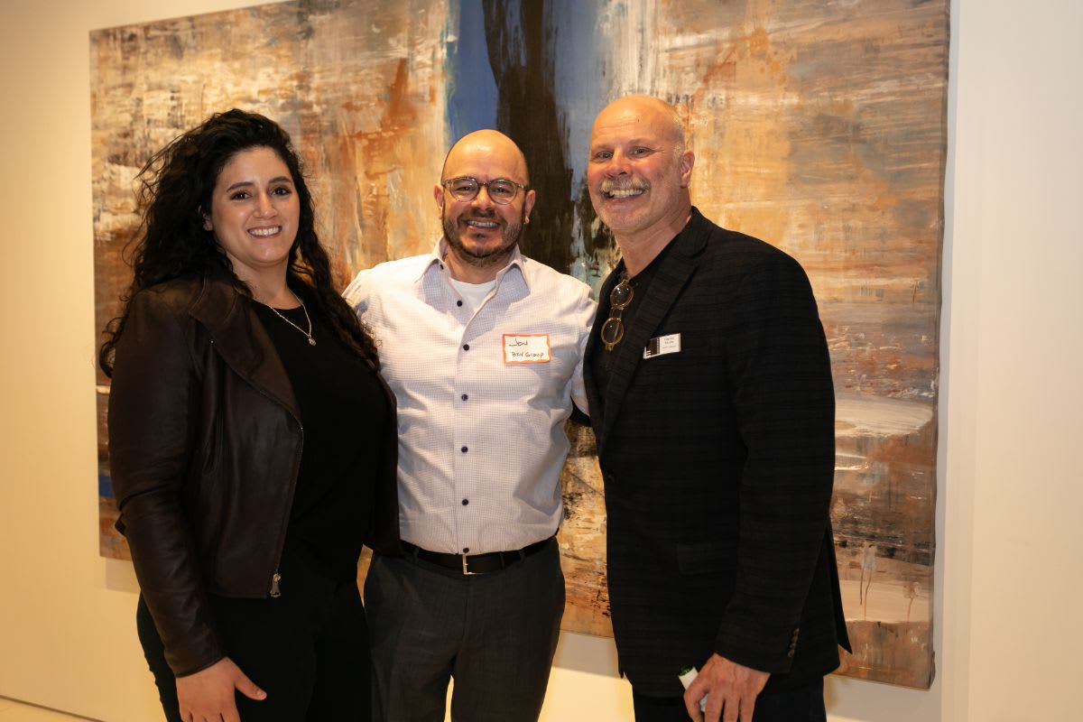 eggersmann chicago showroom manager, harold skulte, and an attendees of the chicago lgbtqia spring social in the showroom