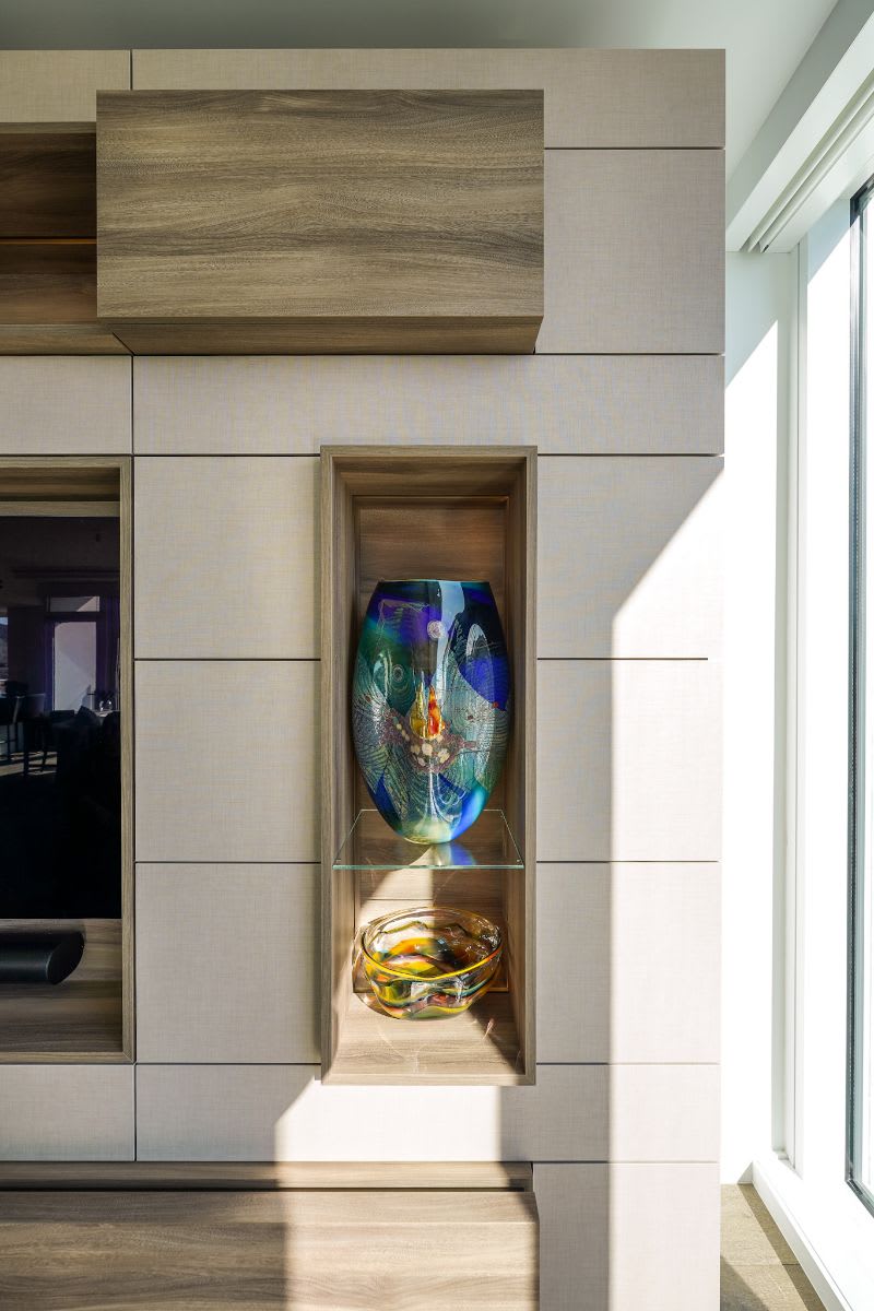 art niche in a modern media wall with a light but warm palette designed by eggersmann for a new four seasons residence in los angeles