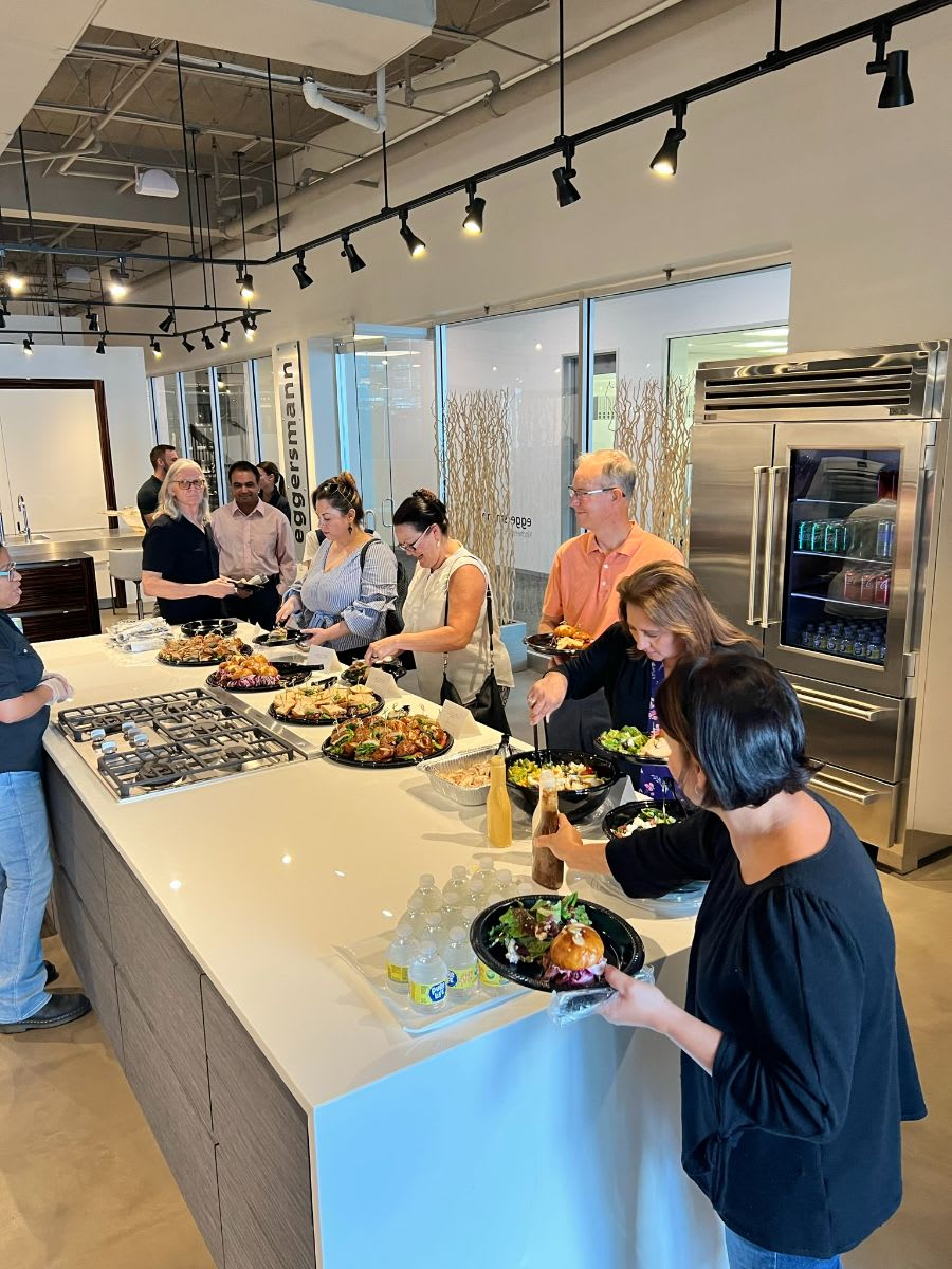 attendees enjoying a lunch buffet after anne breux's euro design trends 2022 presentation at eggersmann houston