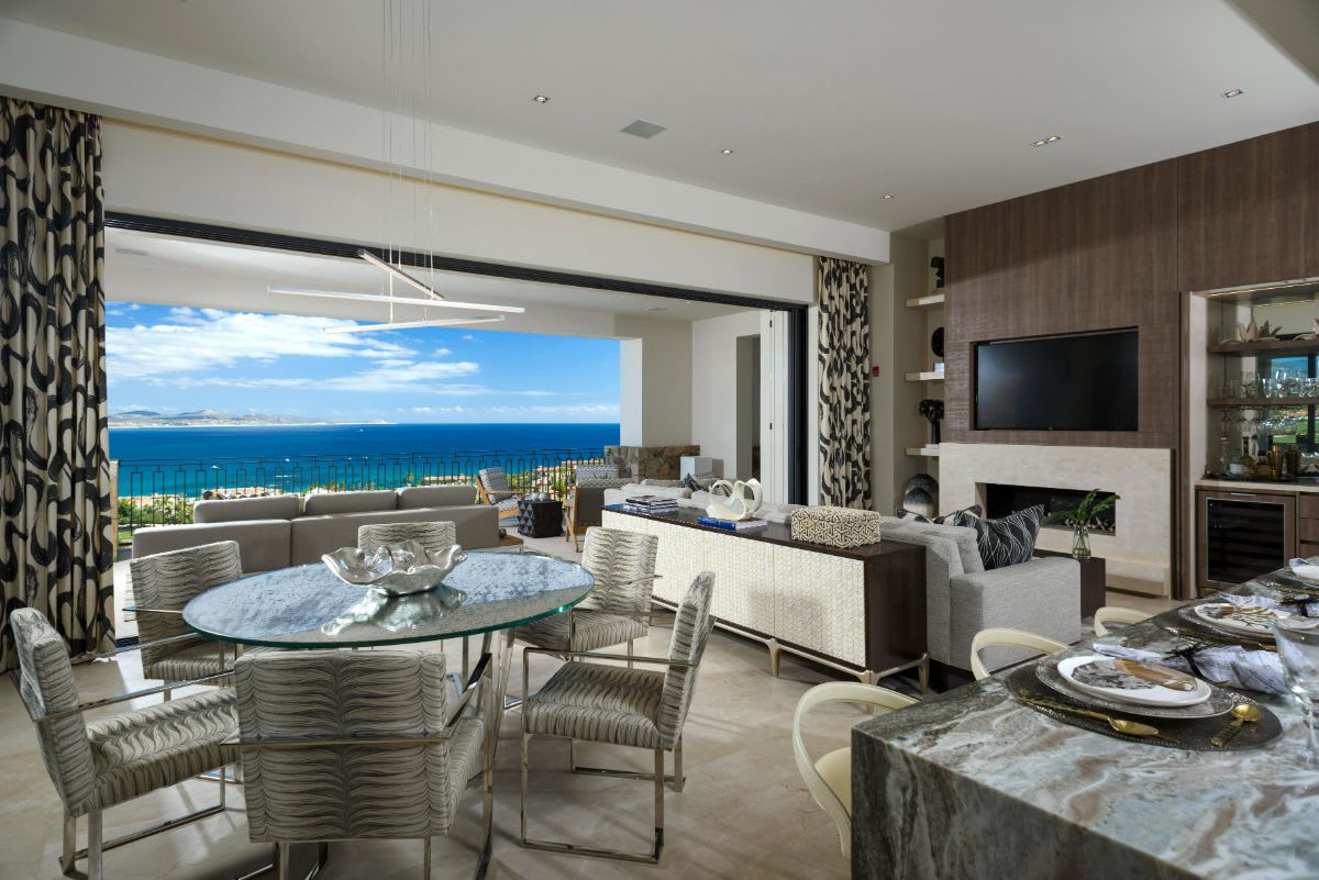 zen dining living room that brings in nature with expansive floor-to-ceiling windows