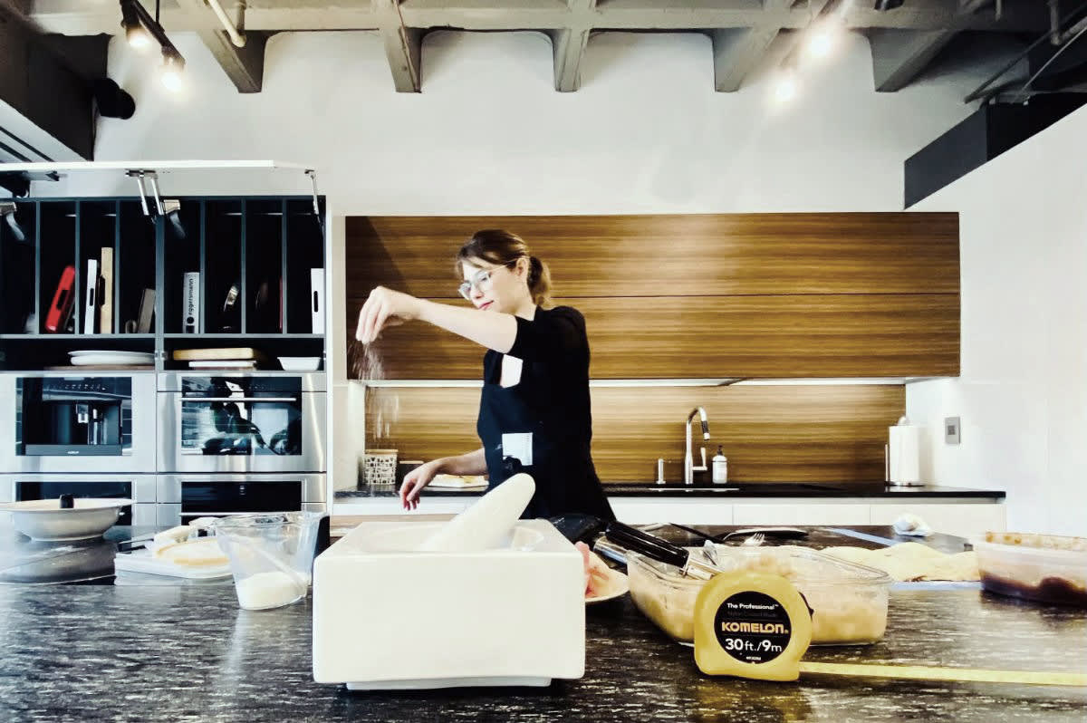an eggersmann employee prepares a family Danish recipe in a display kitchen in eggersmann new york