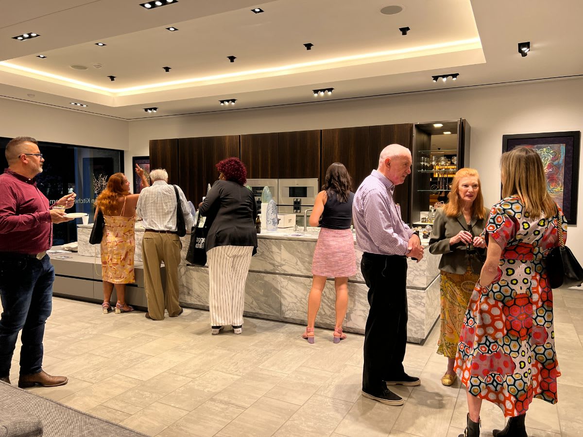 attendees enjoying light bites in the eggersmann showroom attendees at the dallas design district's 2022 curated dallas art walk