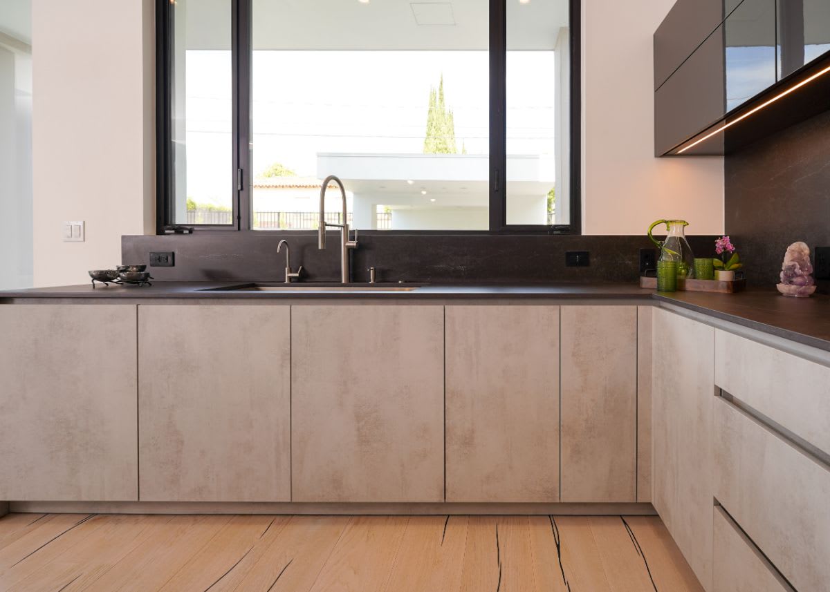 base perimeter cabinets in concrete finish in a luxury beverly hills home