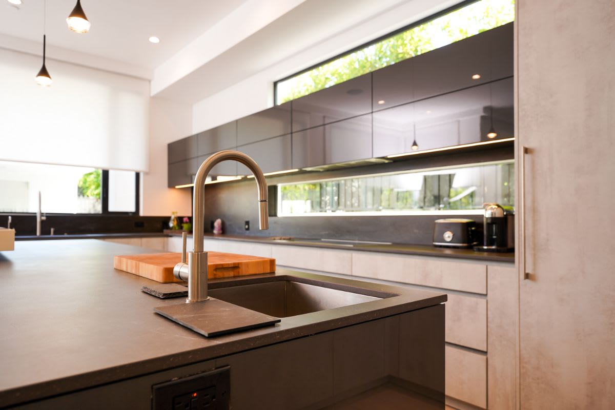 luxury gooseneck faucet on a kitchen island sink in a luxury beverly hills home