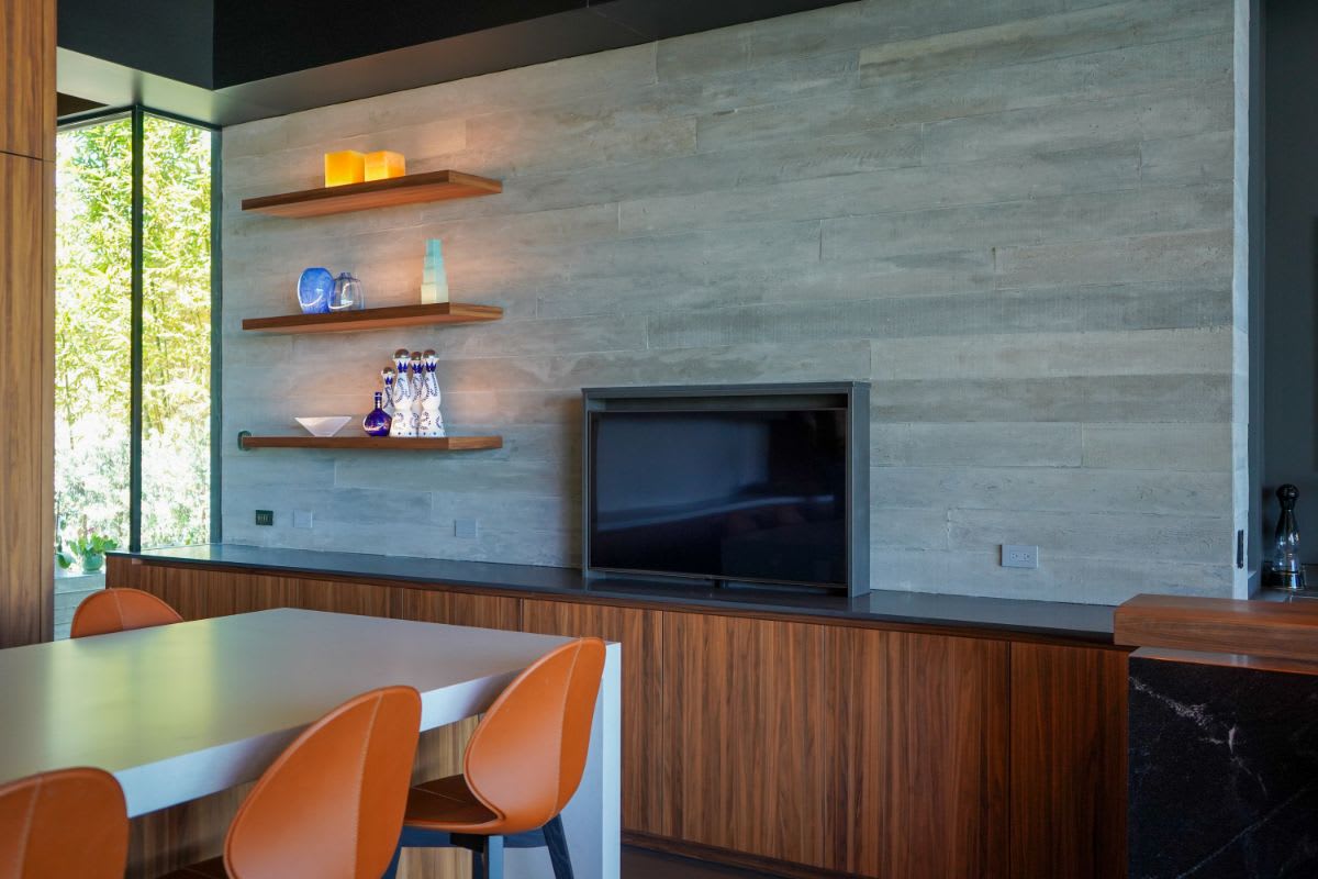 tv raised by a mechanical lift in a pacific palisades home's great room