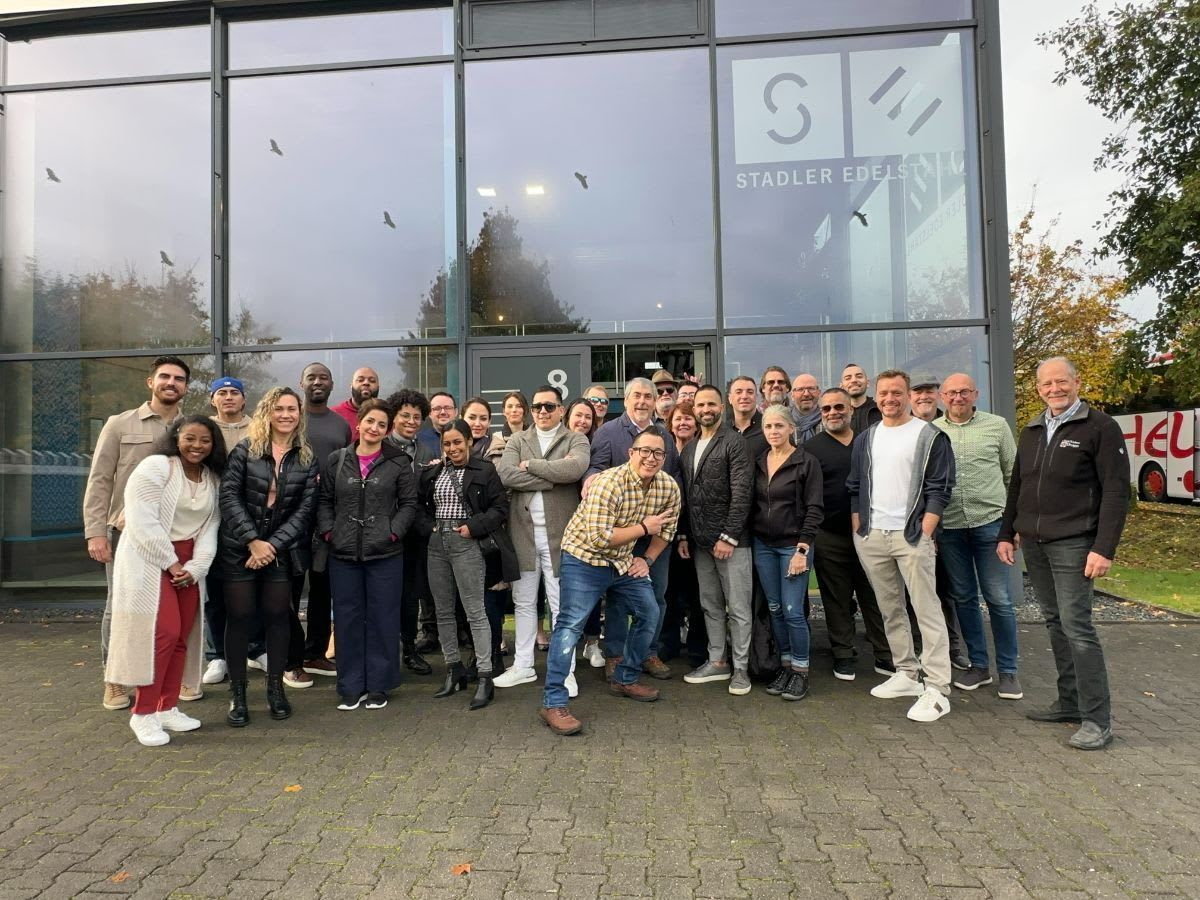 the 2022 eggersmann factory tour group in front of stadler edelstein