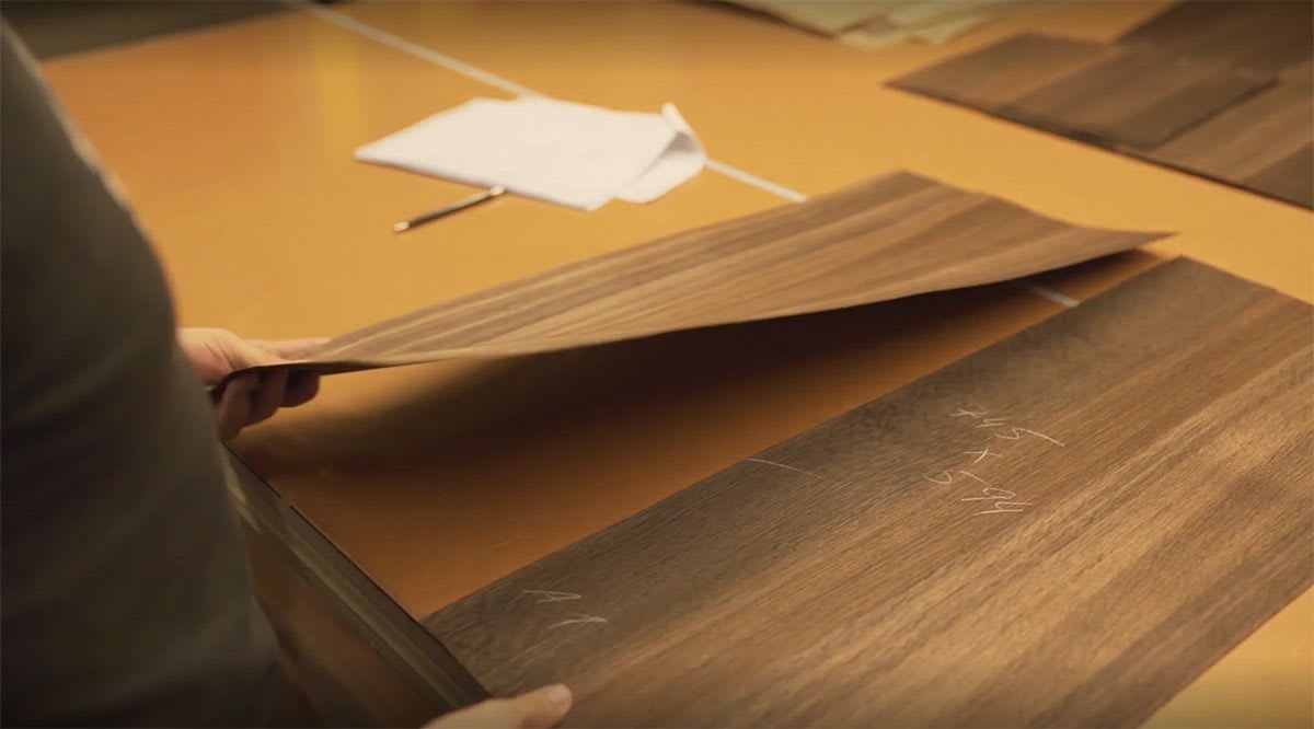 eggersmann cabinetry craftsman book-matching grain by hand on wood veneers