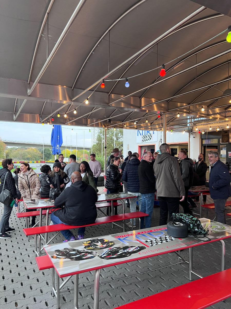 enjoying a snack after the 2022 eggersmann factory tour group race track experience