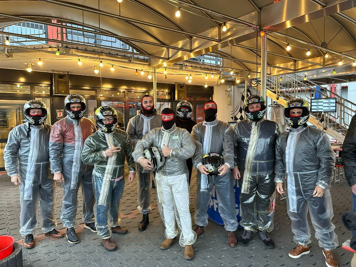 the 2022 eggersmann factory tour group in their safety gear ready for a race track experience