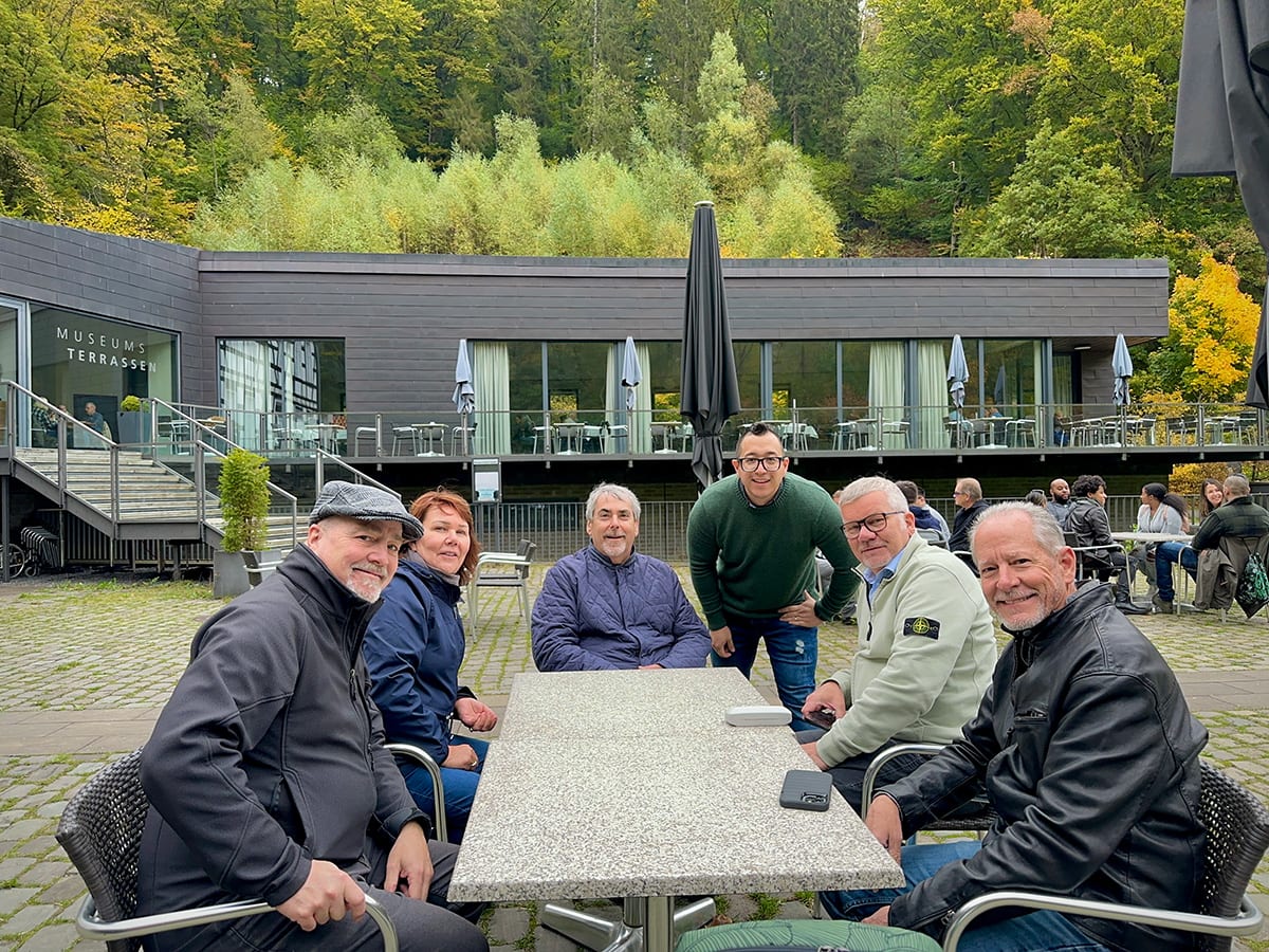 eggersmann team around a table at an open-air museum in germany