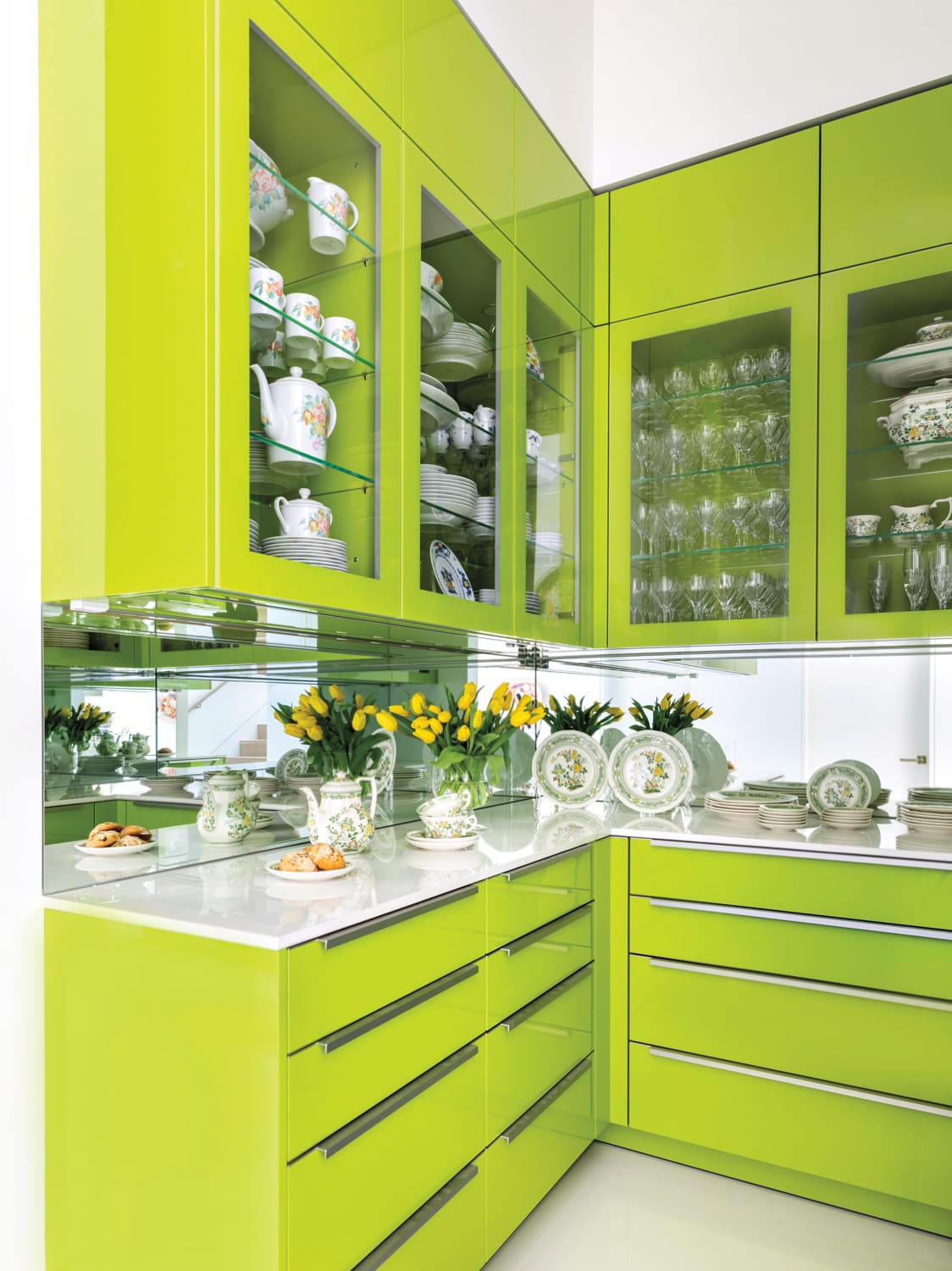 brightly colored cabinetry of a butler's pantry designed by eggersmann for a new tanglewood luxury home in houston