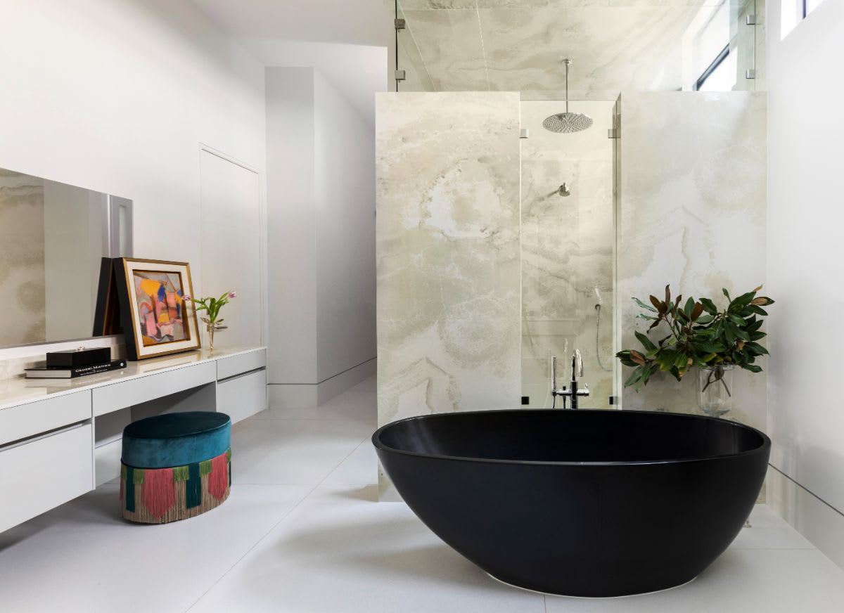black egg-shaped tub of the eggersmann-designed luxury master bath of a new construction home in the tanglewood community of houston texas