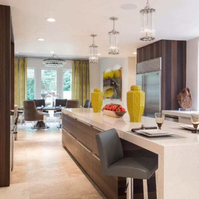 eggersmann-designed kitchen and living area featuring pops of yellow