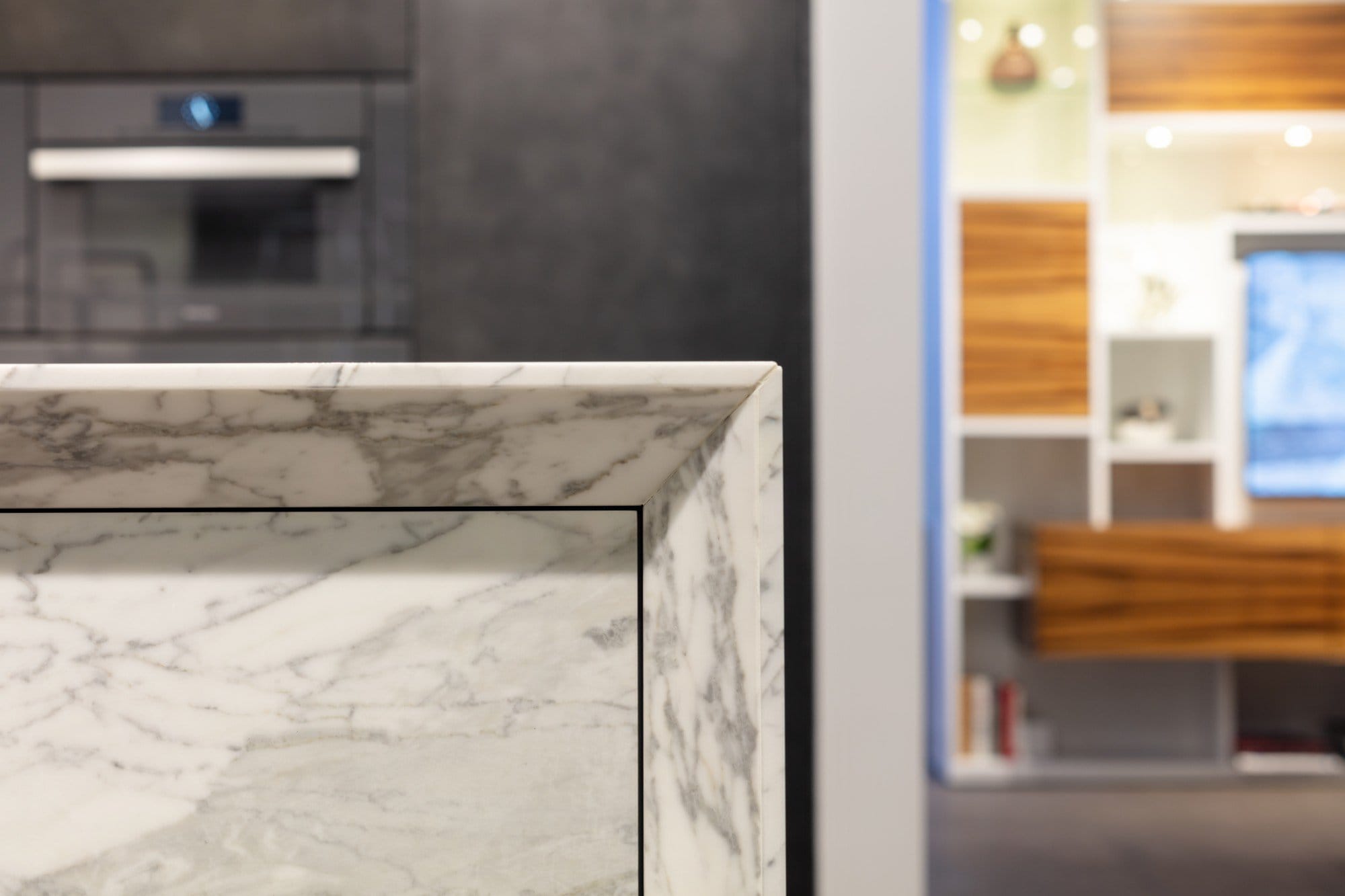 frame7 mitered edge on a stone kitchen island in the eggersmann new york showroom frame7 mitered edge on a stone kitchen island in the eggersmann new york showroom