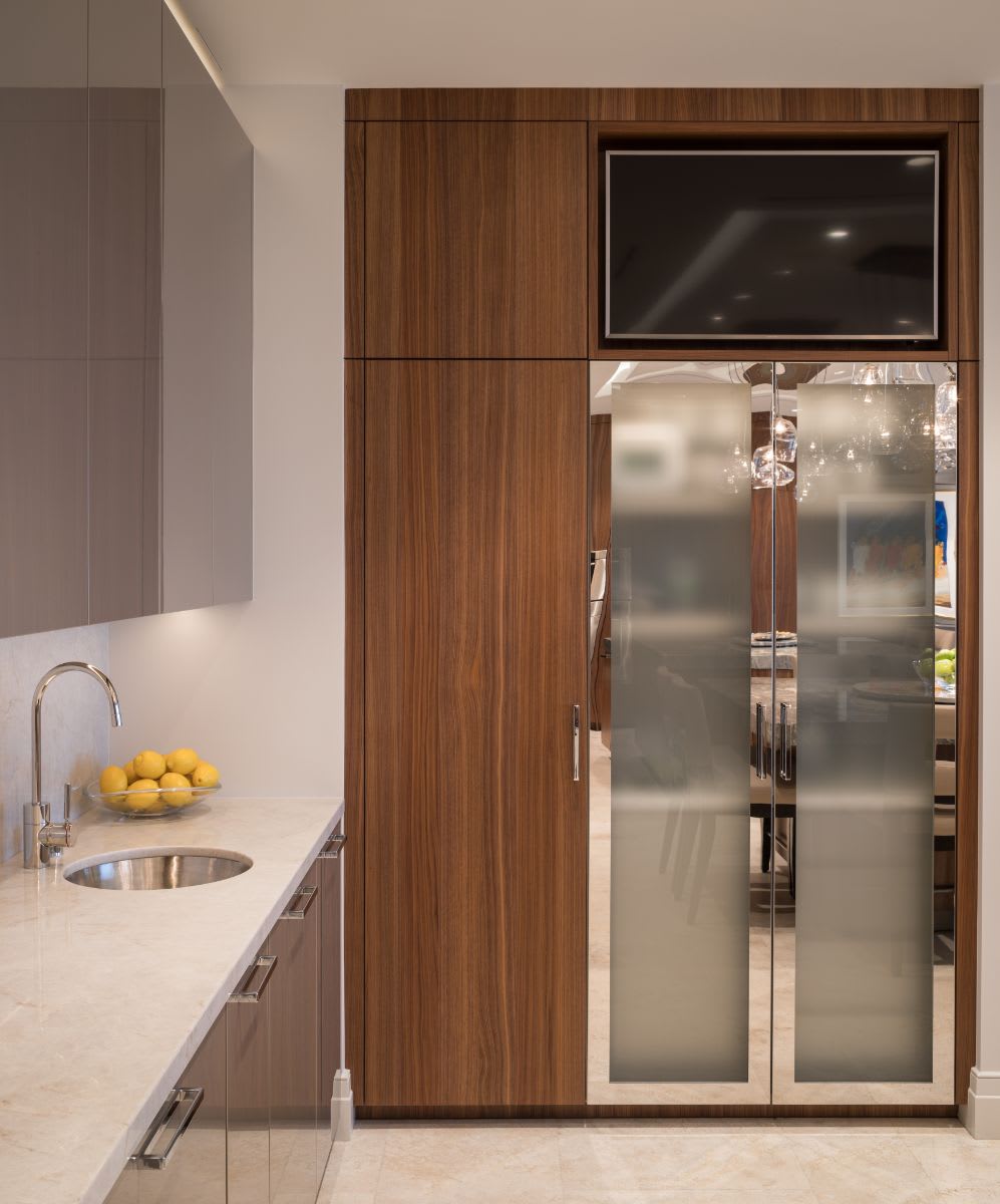 hidden coffee bar with frosted glass doors closed