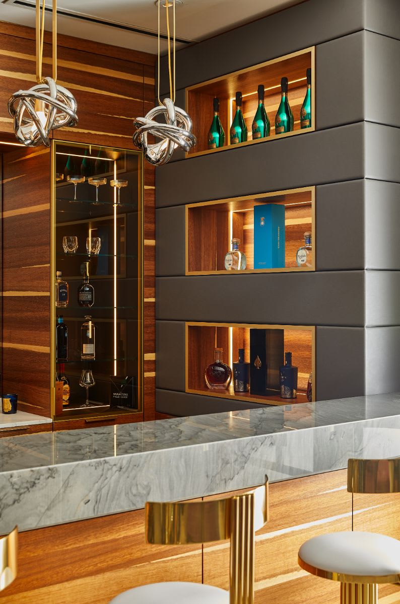 liquor cabinet with glass display niches in a preston hollow home bar designed by eggersmann