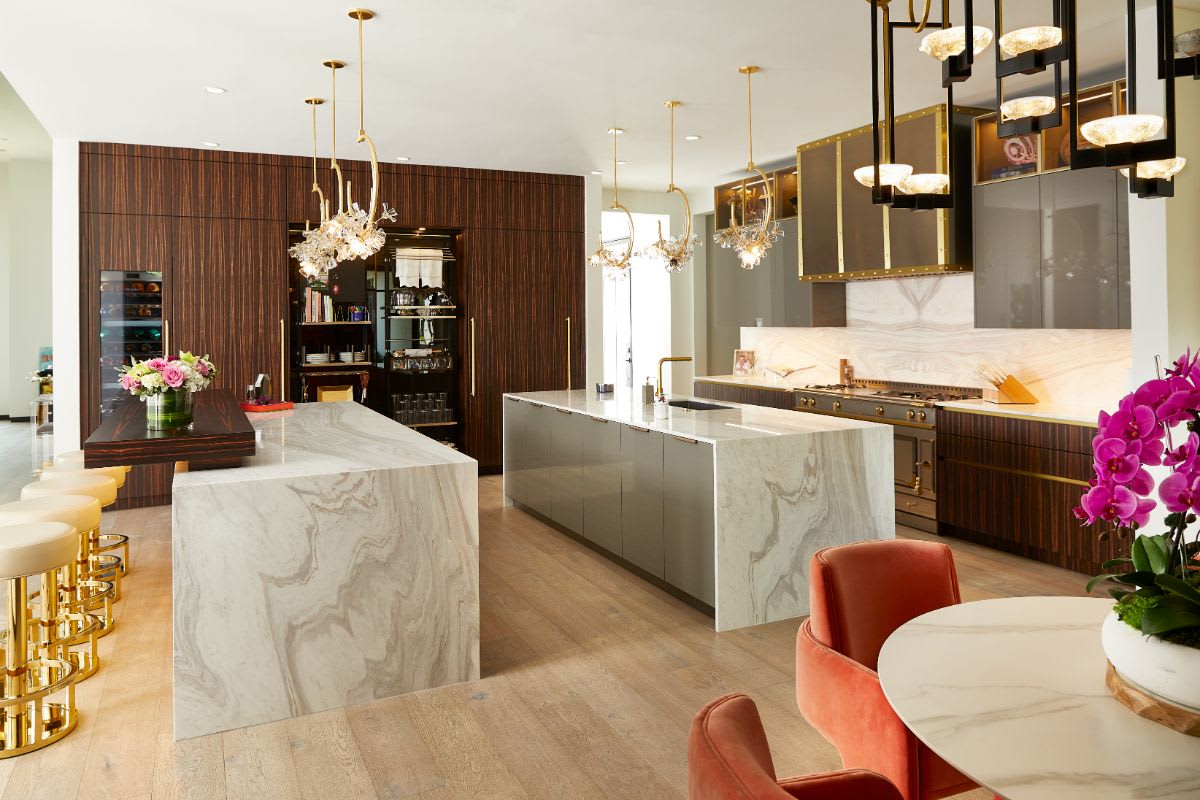 double islands and opened turnstile pantry of preston hollow luxury kitchen remodel designed by eggersmann