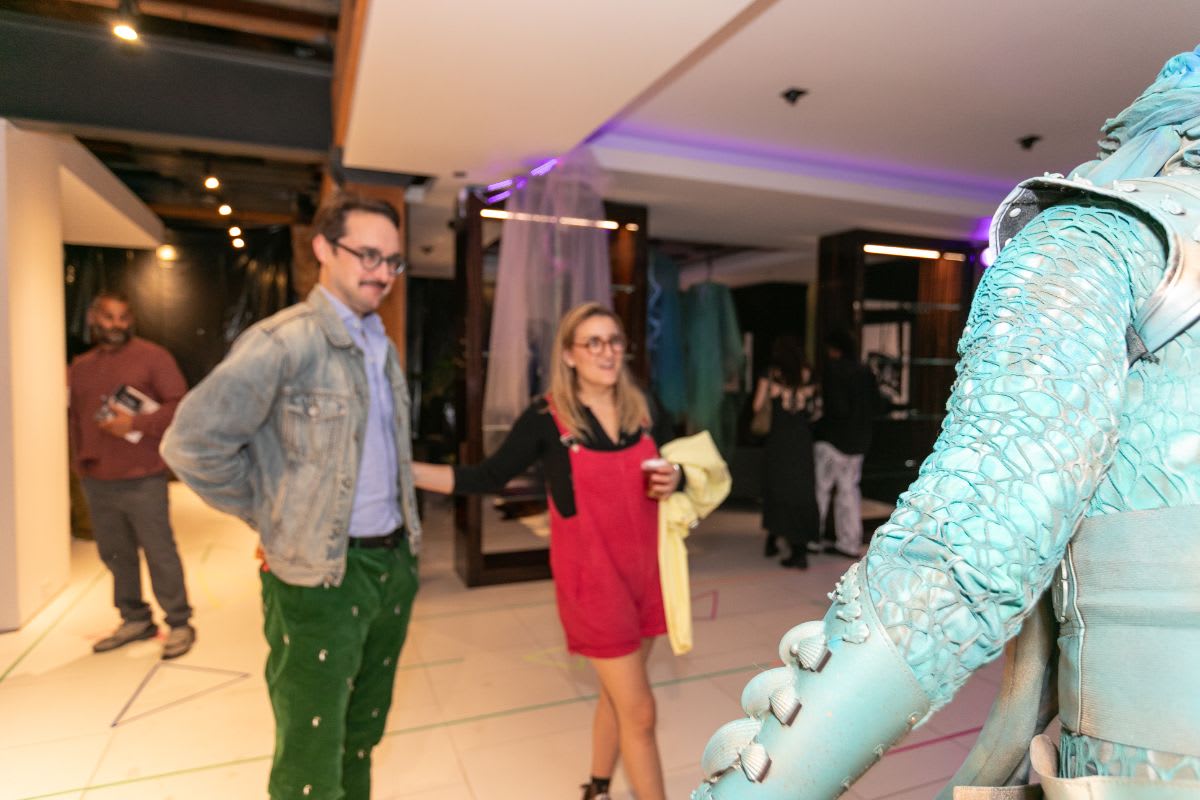guests watch the living statue in the eggersmann chicago showroom during the rndd 2023 gallery walk