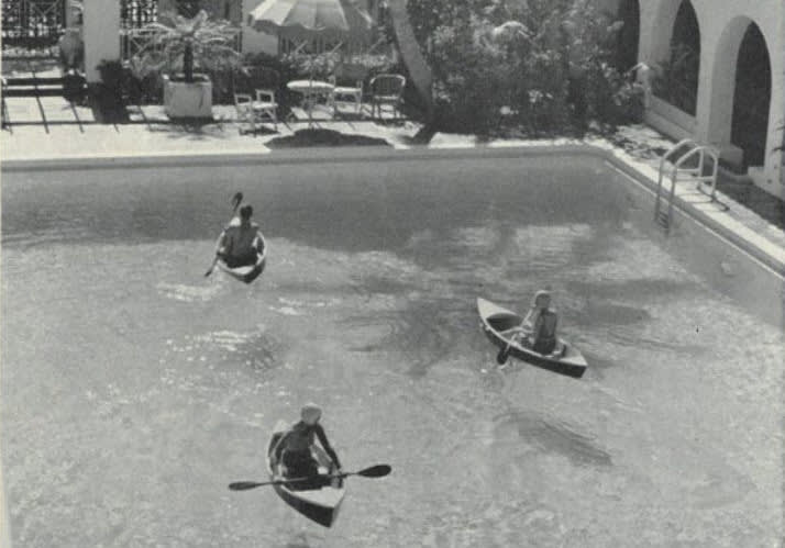 kayaks in the pool of the surf club were just one of the antics members of the club did for entertainment