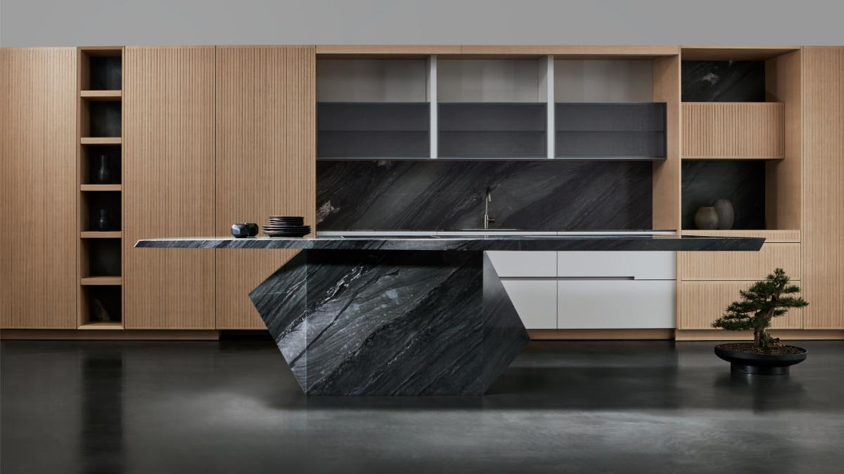 flexibly designed luxury kitchen cabinetry options in wall unit that accompanies the eggersmann nami kitchen island with wall cabinetry including portland linoleum in pebble finish