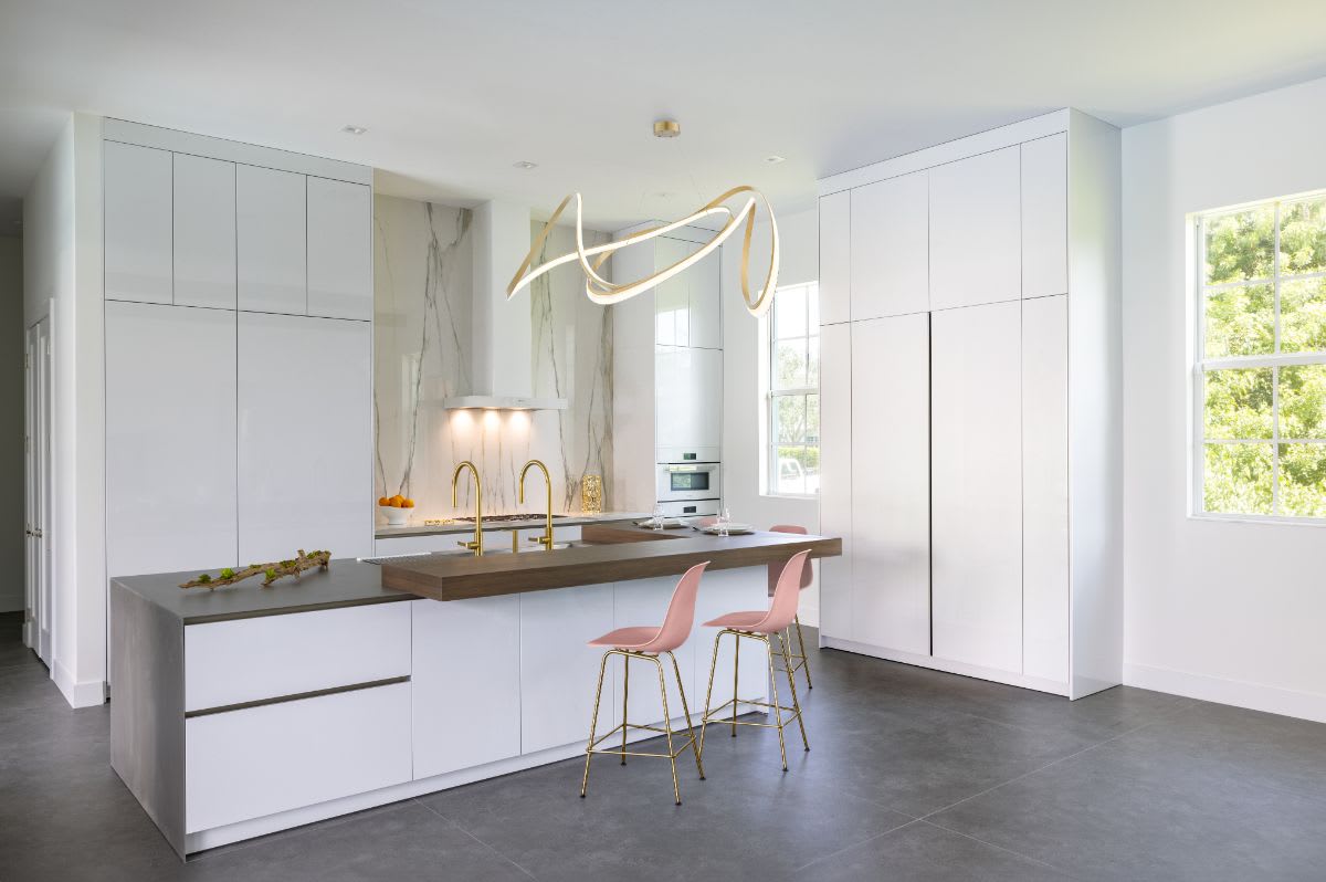jupiter fl luxury white kitchen with hideaway bar with pocket doors closed