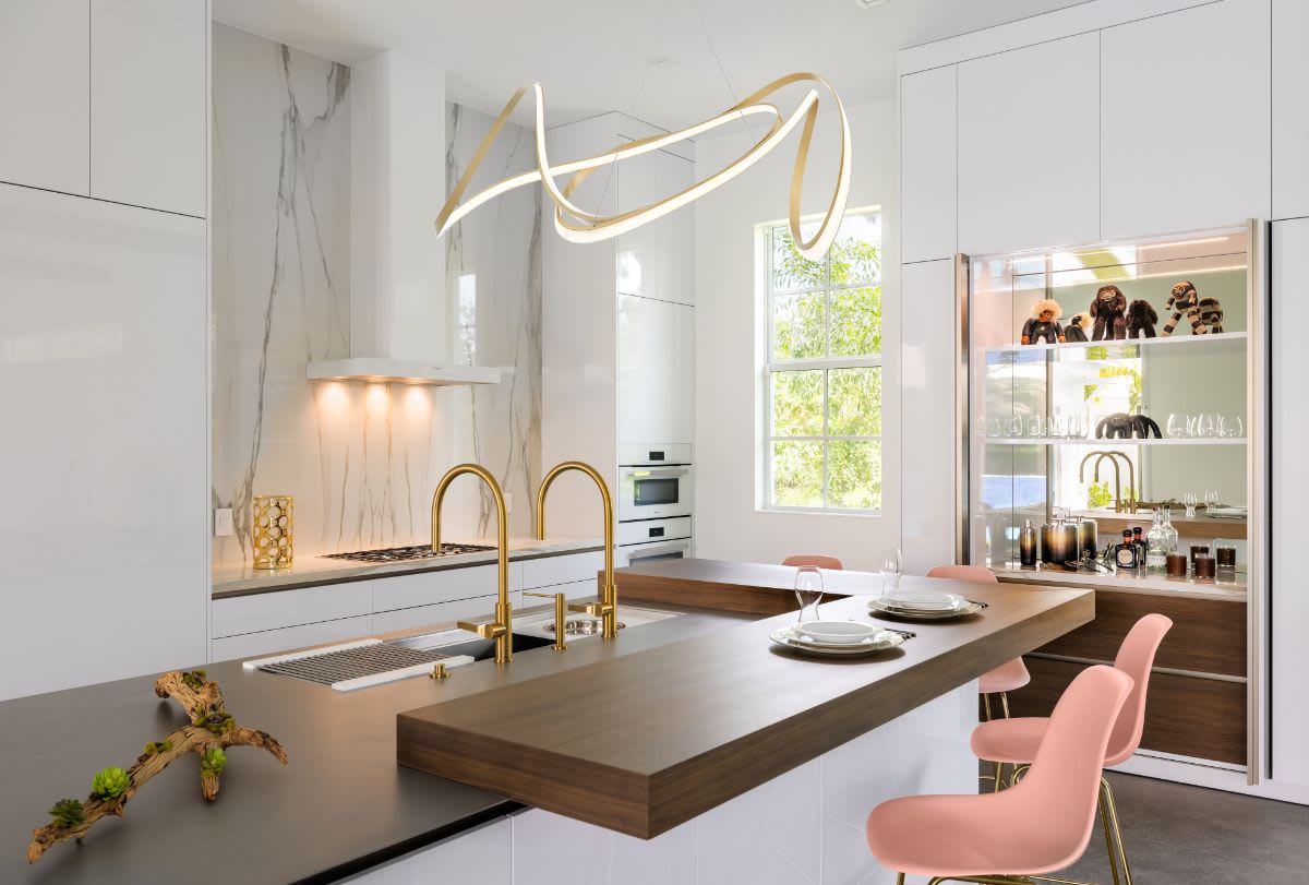 jupiter fl luxury white kitchen with walnut veneer bar top and hideaway bar open