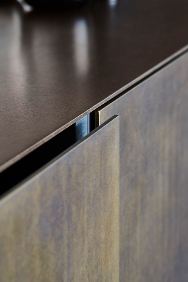 closeup of cabinet fronts of the metal veneer of the skywalk kitchen island