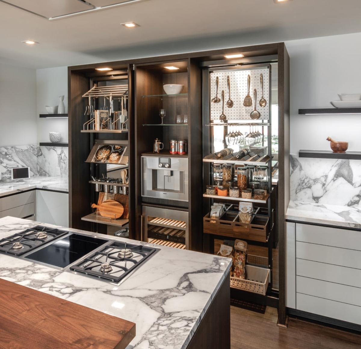 the work's turnstile panty with lots of organizers in a luxury german kitchen designed by eggersmann for a london house mid-rise residence