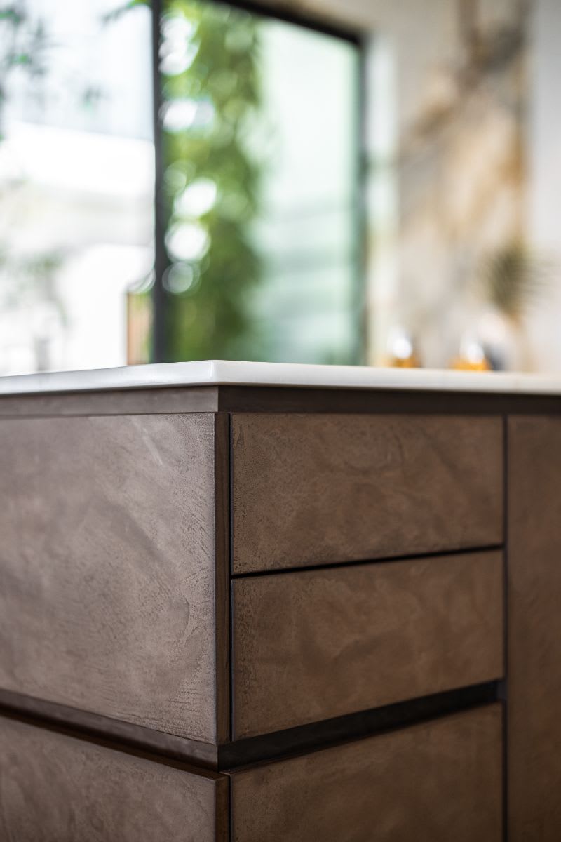 detail of impeccably matching veneers of cabinetry of an island in an eggersmann kitchen of a miami beach intracoastal luxury home
