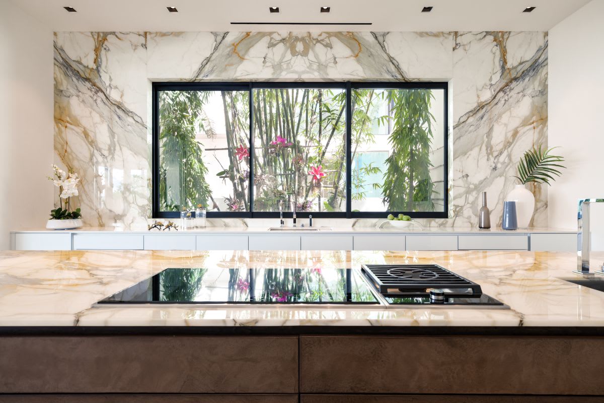 island cooktop and picture window in an eggersmann kitchen of a miami beach intracoastal luxury home