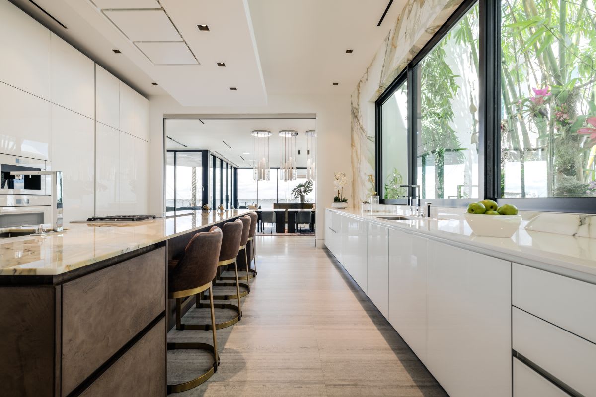 galley between the island and the sink in an eggersmann kitchen of a miami beach intracoastal luxury home