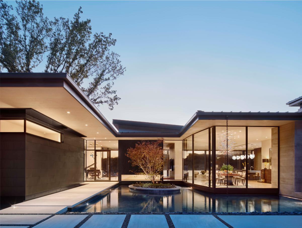 backyard water feature with floating sidewalks of a luxury red oak neighborhood home that won the luxe red Award for architecture