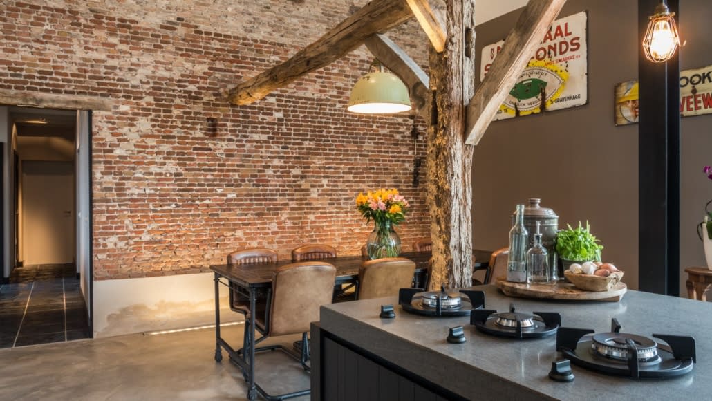 pitt countertop mounted cooking burners in kitchen of a a rustic traditional home