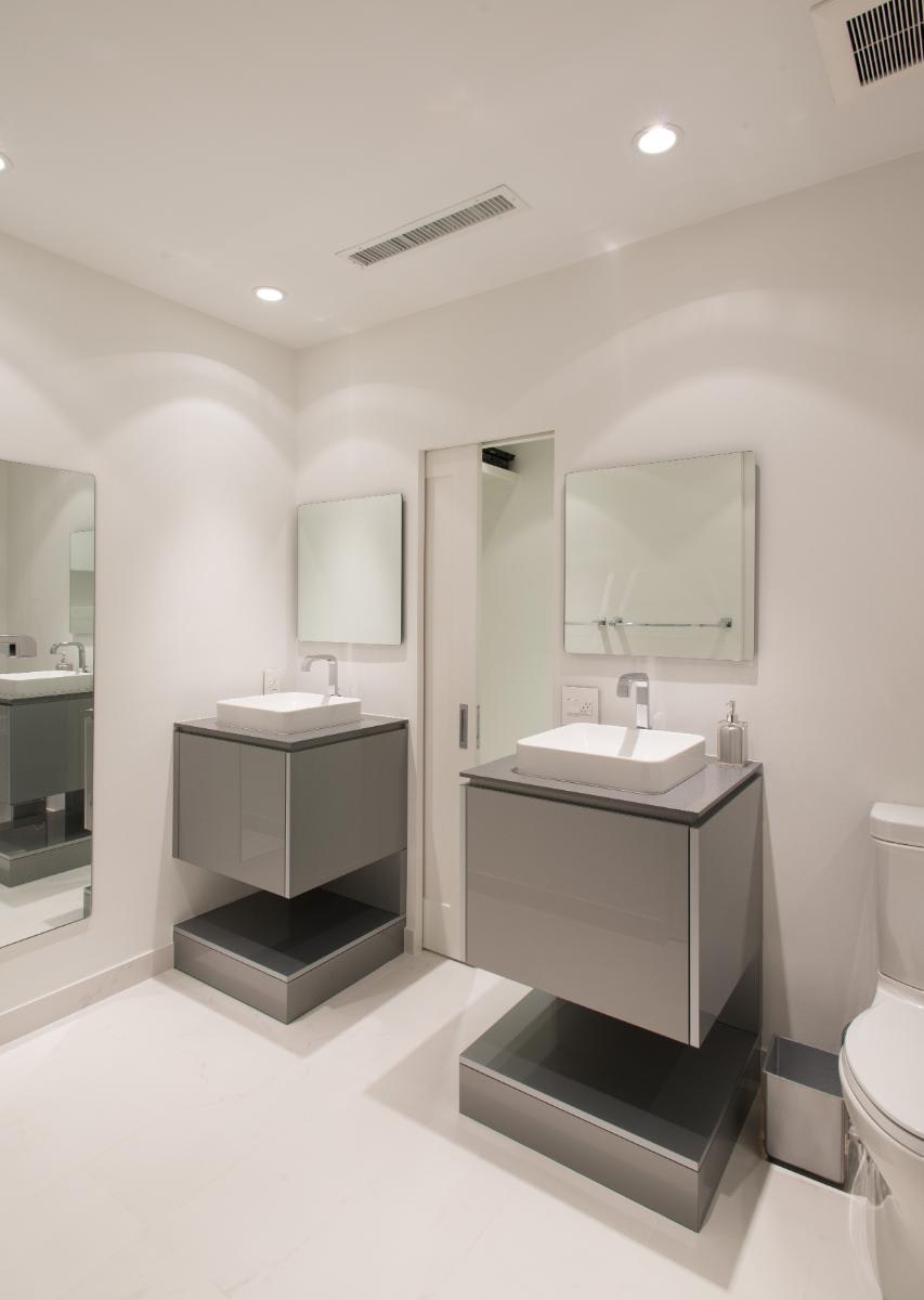 modern floating vanities in a minimalist designed bath