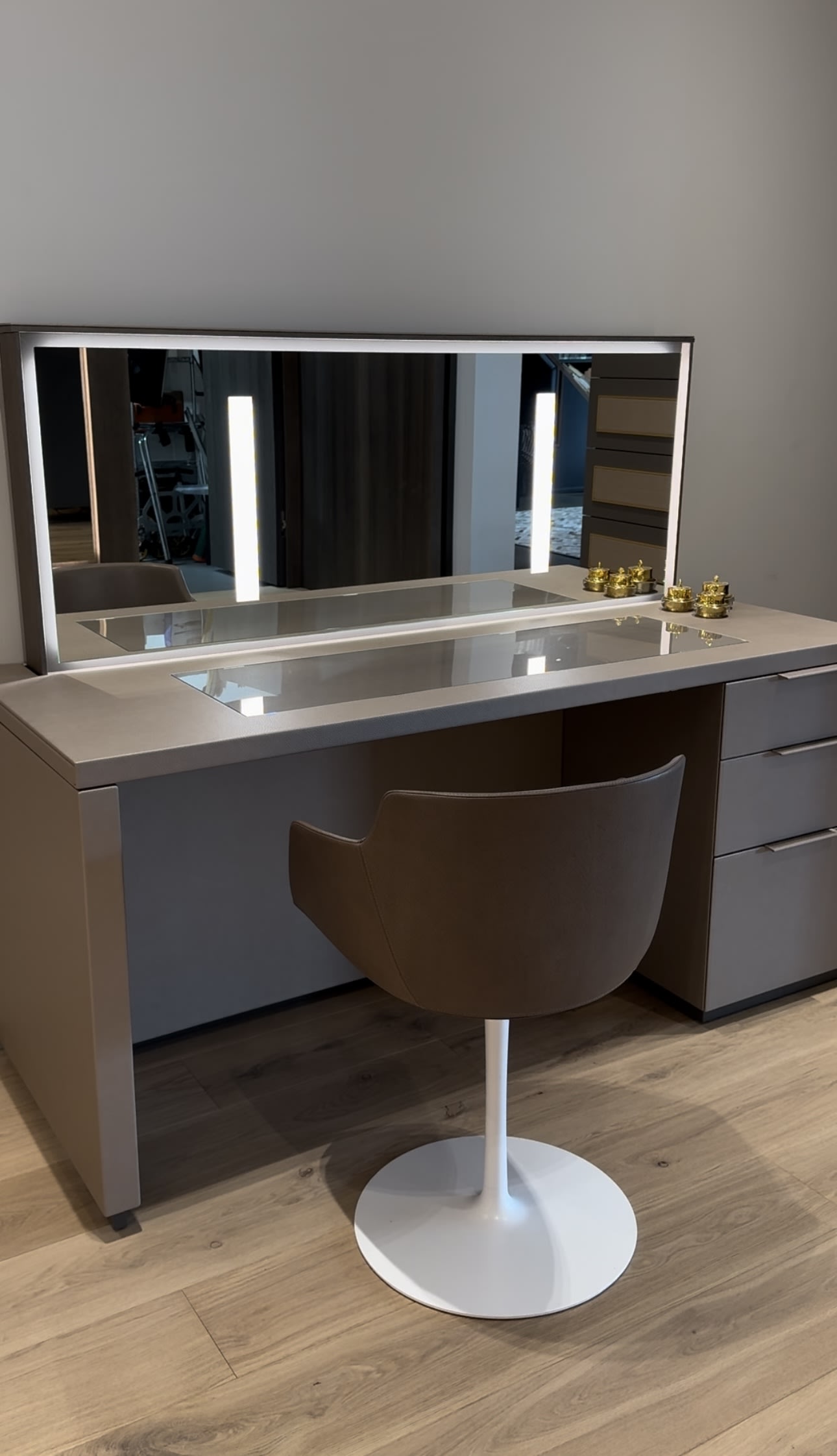 custom luxury vanity with hideaway mirror designed by eggersmann and crafted by schmalenbach