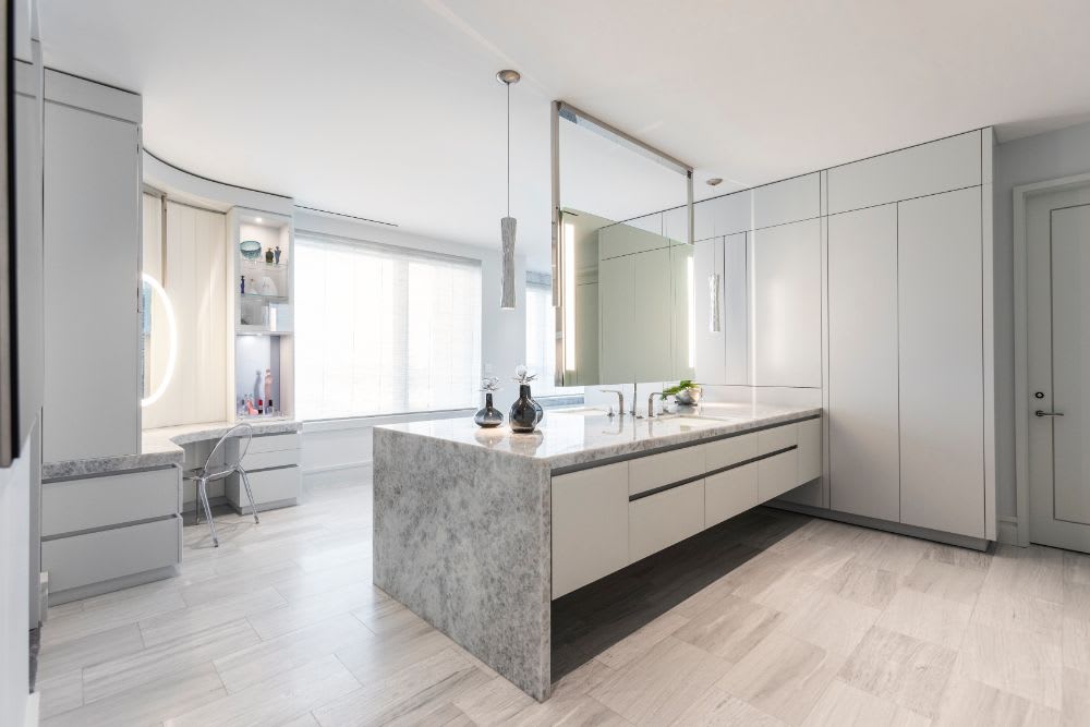 ceiling mounted floating vanity mirror hung in a luxury eggersmann-designed bathroom
