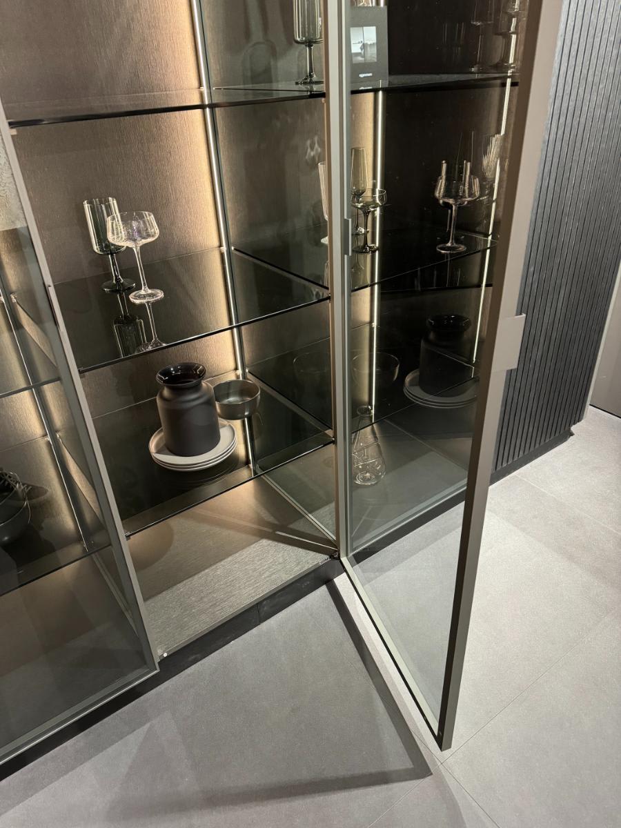 glance glass door open in eggersmann's glow cabinet using furnspin hardware by hettich with glance glass offering hidden storage and display shelving at eurocucina salone del mobile milan 2024