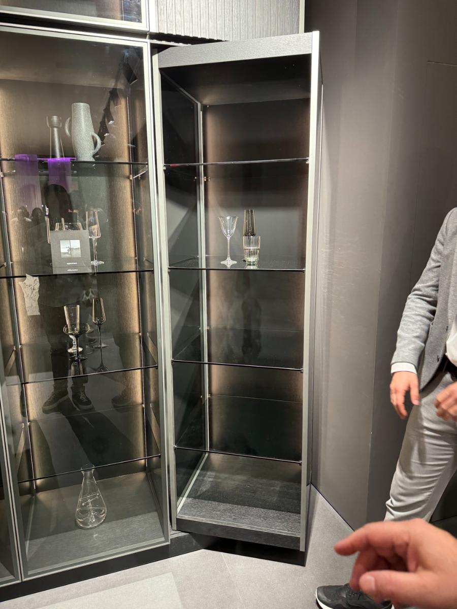 revealed display side of eggersmann's glow cabinet using furnspin hardware by hettich with glance glass offering hidden storage and display shelving at eurocucina salone del mobile milan 2024