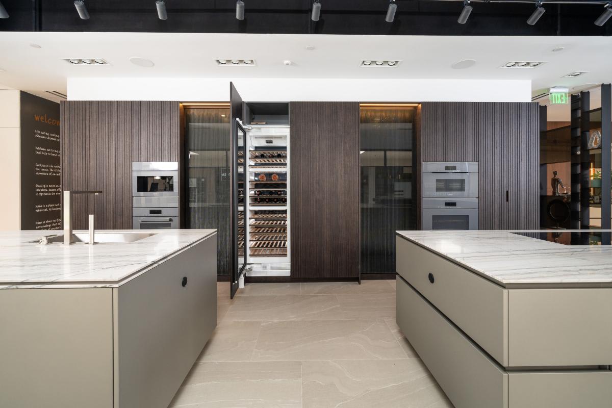 double island kitchen with wine fridge and luxury appliances in a display kitchen of eggersmann laguna showroom
