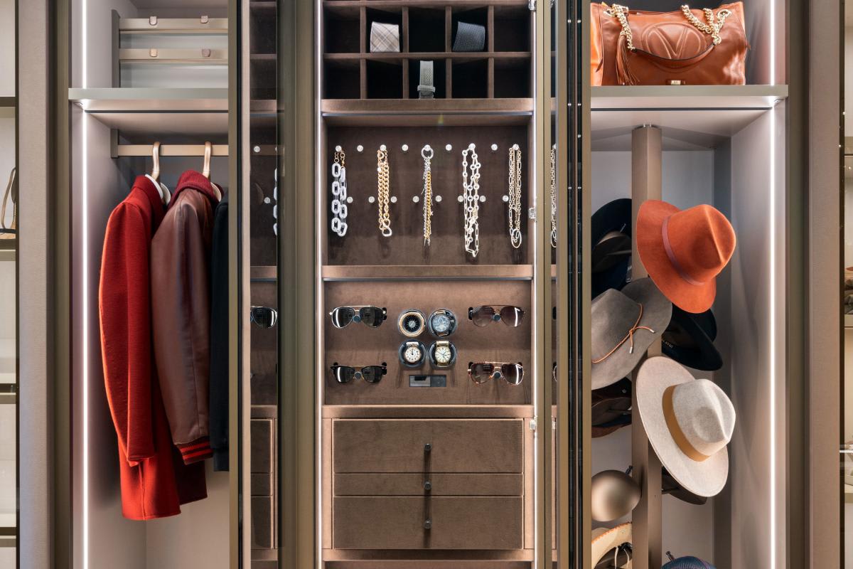 eggersmann-designed closet's specialty storage including hidden safe, sunglass keeper, jewelry display, revolving hat tower, and lou hansell luxury hangers